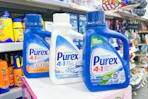 three bottles of purex laundry detergent
