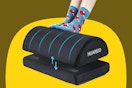 User with their feet on an office foot rest.