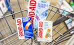 Three Band-Aid products in Walmart shopping cart