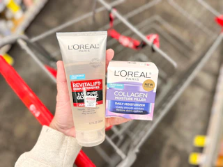 hand holding loreal skin care in cvs