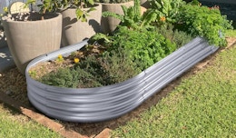 a raised garden bed in a garden in the yard
