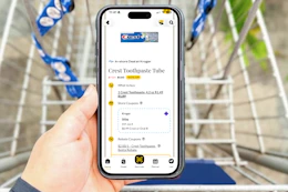 hand hold a smartphone displaying a 1-clip coupon deal in the kcl app