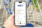 hand hold a smartphone displaying a 1-clip coupon deal in the kcl app