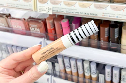 hand holding covergirl trublend concealer in walgreens
