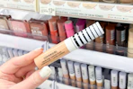 hand holding covergirl trublend concealer in walgreens
