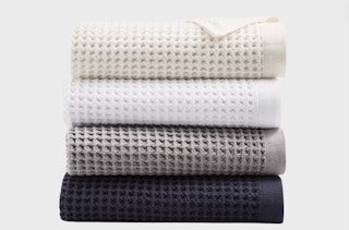 a stack of hotel collection towels