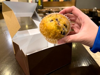 A muffin inside an empty Panera restaurant