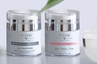 two jars of cream on a table