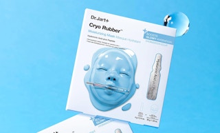 a facial mask pack on a blue background