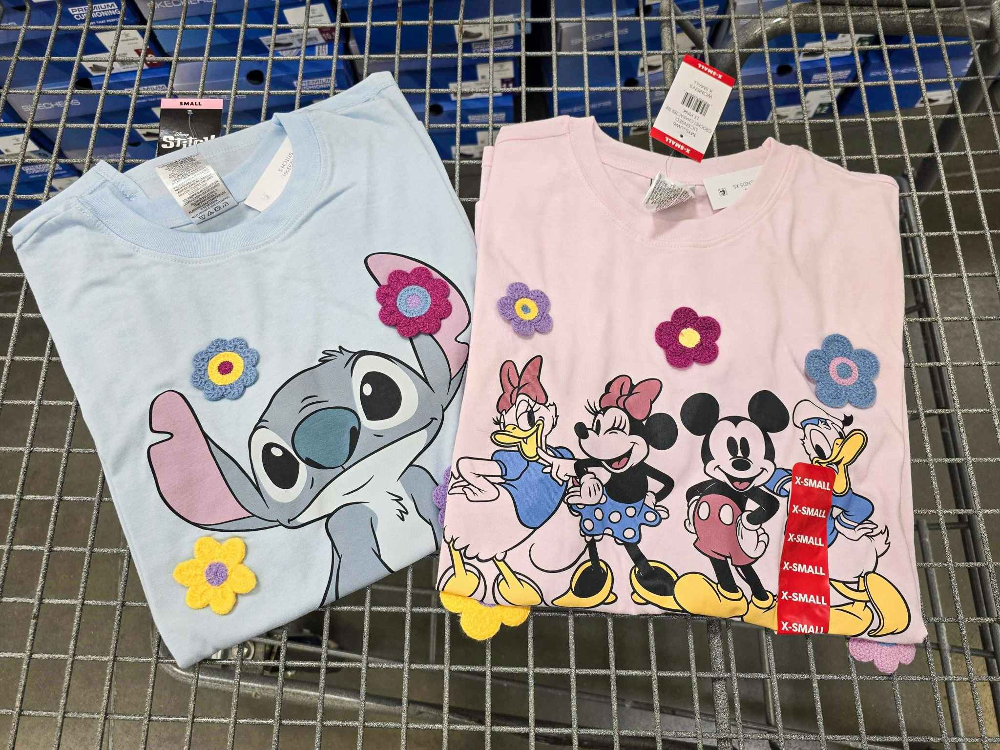 2 character tees in a cart featuring stitch and mickey