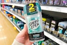 person holding speed stick deodorant in front of other deodorant