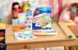 a Crayola Color Wonder Magic Light Brush on a wooden table 