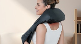a person with a neck massager on their neck