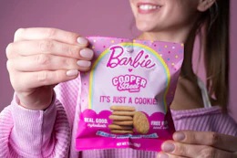 a teenage holding cooper street barbie cookies
