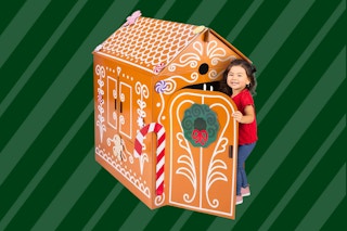 Stock photo of the Kidtopia Gingerbread Play House (door being opened up by a small child)