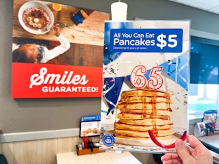 A sign in IHOP advertising an offer for All You Can Eat Pancakes for $5