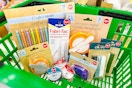 craft items in a green dollar tree shopping basket
