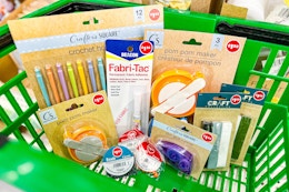 craft items in a green dollar tree shopping basket