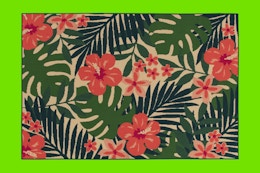 Stock image of the Mainstays 7'x10' Pink Palm Outdoor Rug