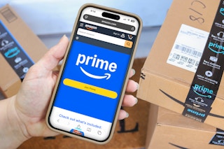 someone holding a phone showing amazon prime