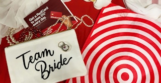 target bag, team bride bag, pearls, orchid on red cloth
