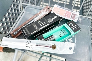 elf eyeshadow, setting spray, makeup brush, and more in a cart
