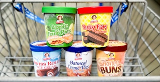 Little Debbie ice cream pints stacked in the basket of a Walmart cart