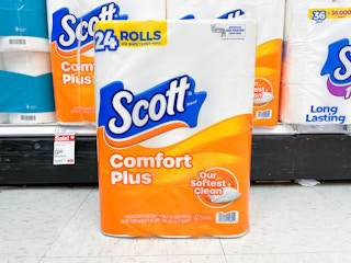scott 24-pack toilet paper sitting on the floor in front of a target shelf