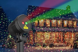 Christmas projector displaying on a house