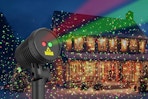 Christmas projector displaying on a house