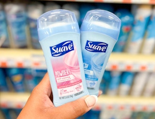 hand holding two Suave deodorants