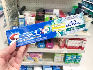hand holding crest premium toothpaste clearance at target