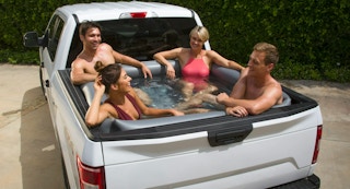 photo of adult inflatable pool in truck bed