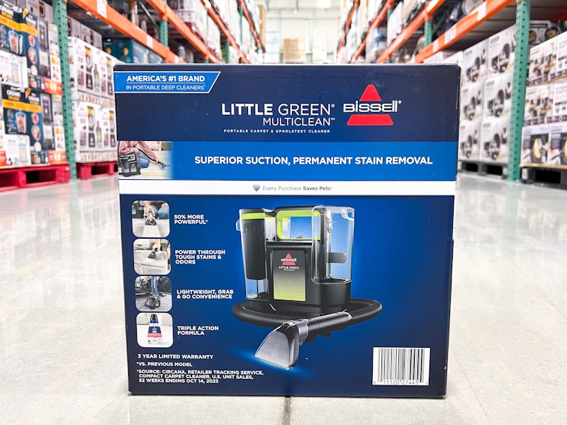 bissell little green carpet cleaner on the floor in an aisle