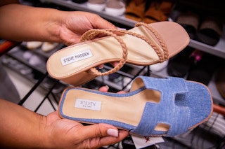 Hand holding to different show wear breands with similar sounding names