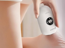 a person using an electric foot callus remover on their foot