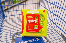 AI Image created by ChatGPT of the Gutzy fruit pouch 4-count package in Walmart shopping cart