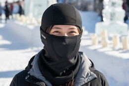 a woman wearing a balaclava mask