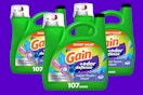 three bottles of laundry detergent 