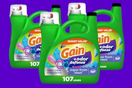 three bottles of laundry detergent 