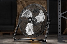a floor fan in a warehouse