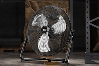 a floor fan in a warehouse