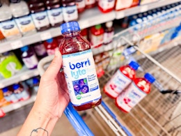 Berri Lyte Organic Electrolyte Beverage held up over Walmart shopping cart