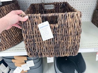 hand grabbing storage bin off Target shelf