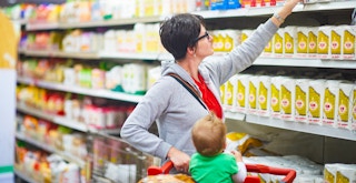 Mother with baby in a shopping cart