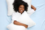 a woman with two pillows