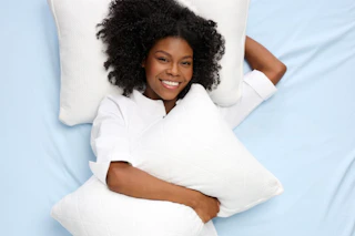 a woman with two pillows