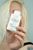 hand holding Olaplex Hair care