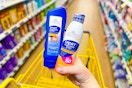 hand holding studio selection sunscreen at dollar general