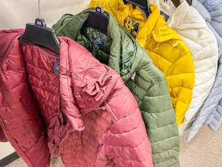 different color puffer jackets on display